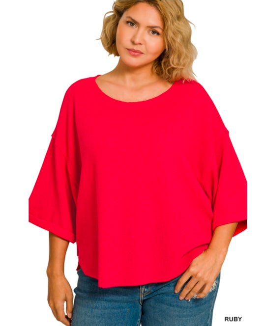 Double knit exposed seam curved hem short sleeve top