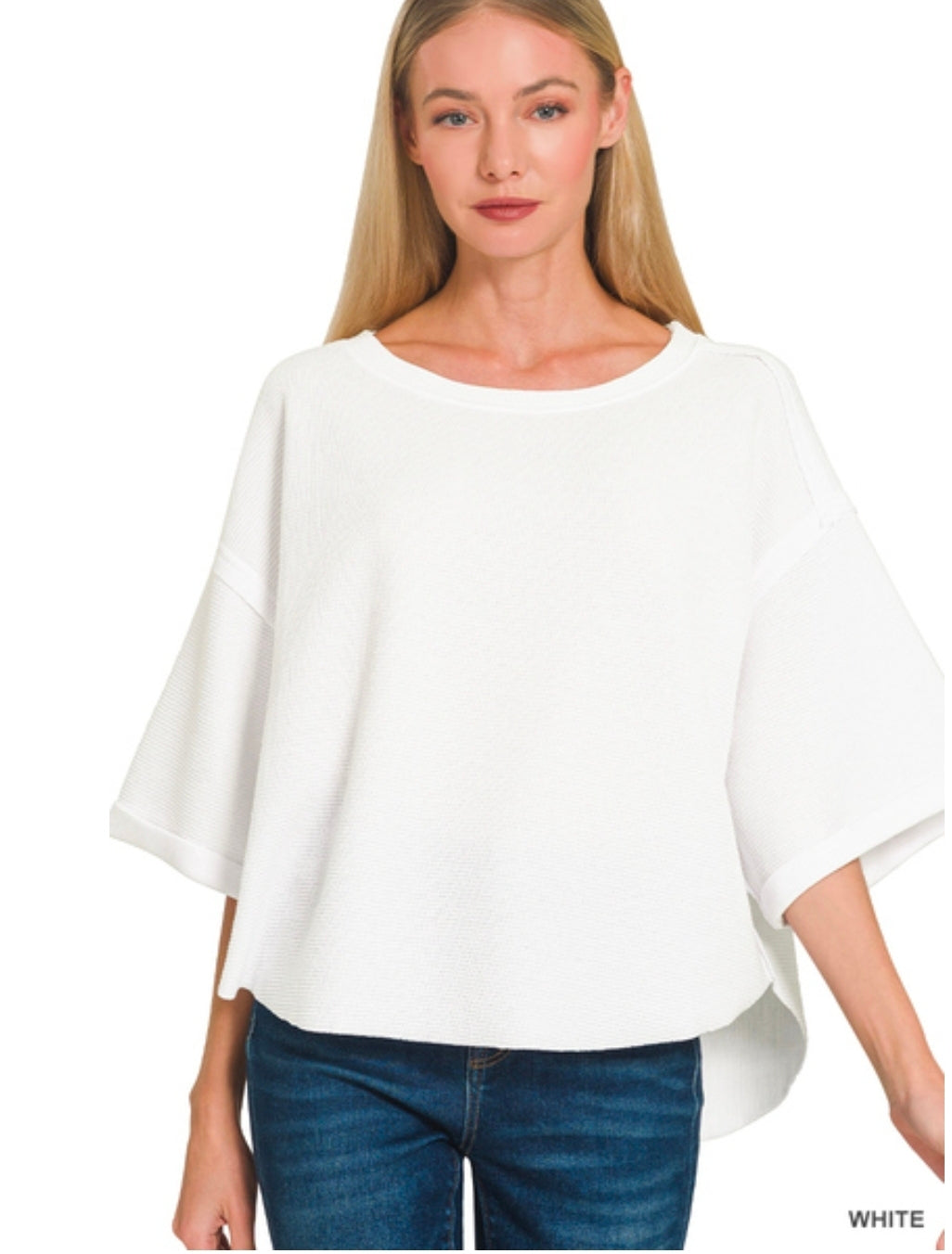 Double knit exposed seam curved hem short sleeve top