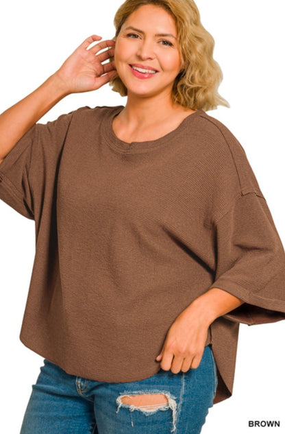Double knit exposed seam curved hem short sleeve top